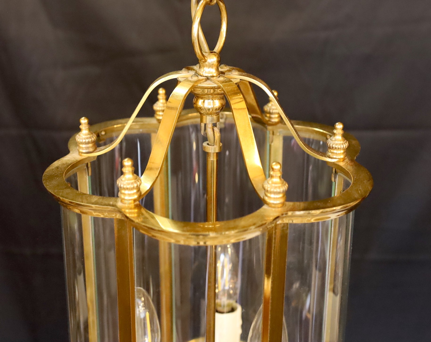 A pair of Georgian style lacquered brass globe hexagonal hall lantern, height 45cm. width 37cm